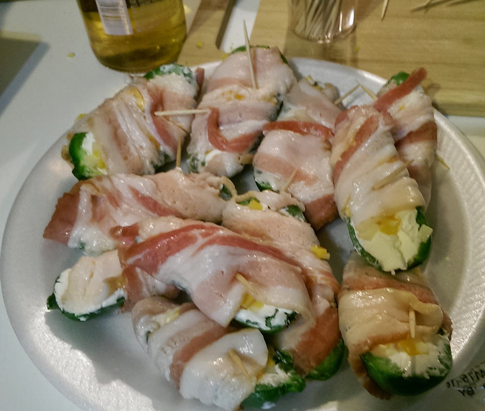 Jalapenos wrapped in bacon, ready to be cooked